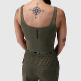 Olive LYCRA® 2-in-1 tank top worn by model, back view showing compass tattoo
