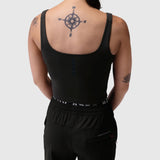 Black LYCRA® 2-in-1 tank top worn by model, back view showing compass tattoo