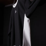 Terry crew neck sweatshirt in black with white stripe detail, modeled on person