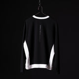 Black and white Terry Crew Neck sweatshirt on hanger, back view showing vertical text branding