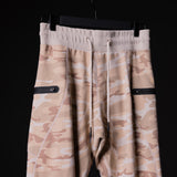 SP'19 Sidelock Utility Jogger in tan camouflage, hung on display against black background