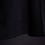 WN'20 Oversized Cinch Tee in black, detail shot of fabric and branding