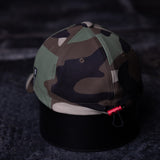 flatlay WN'22 Water-Resistant Cinch Hat in camouflage and black, top view