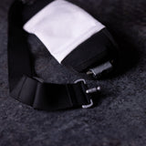 flatlay WN'18 Training Belt Pack in black with white interior pocket, overhead view