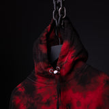 SM'22 Tie Dye Hoodie in red and black tie dye, displayed on model against dark background