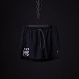flatlay SP'22 Vintage 5" Training Short in black with "TRANSCEND" text, front view