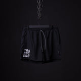 SP'22 Vintage 5" Training Short in black, hanging on chain against dark background