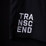 SP'22 Vintage 5" Training Short detail shot showing white embroidered 'TRANSCEND' text on black fabric