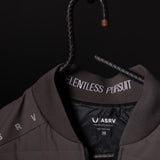 SP'23 Waterproof Run Vest in brown displayed on hanger, showing label detail and front design