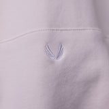 Tech Terry Eagle Hoodie detail closeup showing embroidered wing logo on light purple fabric