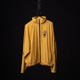 SM'24 Track Jacket in yellow, displayed on hanger against black background