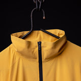 SM'24 Track Jacket in yellow, hung on hanger showing collar and front zipper detail