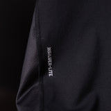 SM'19 Singlet Tank in black, detail shot of side seam and branding label