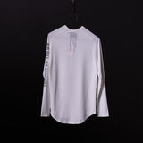SP'20 long sleeve shirt in white, displayed on hanger against black background