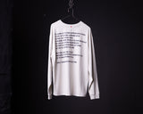 White long-sleeve graphic tee with risk-themed text printed on back, displayed on hanger against dark background