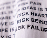FA'23 Graphic Capsule detail closeup showing text print on white fabric