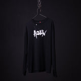 Black long-sleeve graphic tee with white 'BABY' text design, displayed on hanger against dark background
