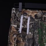 FA'23 Training Division Mesh Shorts in camo/earth tones, hung on hanger detail shot
