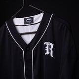 FA'21 Reversible Jersey in black with white piping on hanger, front view