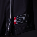 FA'21 Reversible Jersey label detail closeup showing Relentless Pursuit branding on black fabric