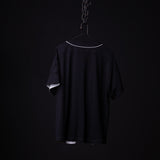 FA'21 Reversible Jersey in black on hanger against dark background, back view