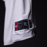 FA'21 Reversible Jersey label closeup detail shot showing Relentless Pursuit branding on white fabric