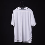 FA'21 Reversible Jersey in white, displayed on hanger against black background, back view