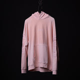 SS'20 Reverse Weave Hoodie in pink, displayed on hanger against black background