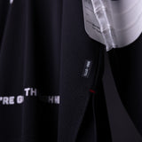 SM'23 Long-sleeve Jersey in black, detail shot of fabric texture and care label