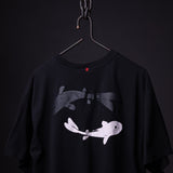 SP'23 Graphic Tee in black hanging on hanger, featuring white and gray fish illustration