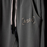 Garment Dyed Zip Jogger in charcoal gray with ASRU logo, worn detail shot