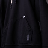 FA'20 Distressed Hoodie in black, detail shot of pocket and label