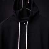 FA'20 Distressed Hoodie in black with white drawstrings, front view on model