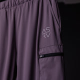 WN'22 Cyber Zip Jogger in purple worn on model, showing side detail with cargo pocket and zipper
