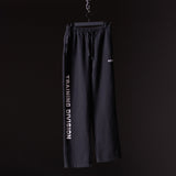 FA'23 Straight Leg Jogger in black, displayed on hanger against dark background