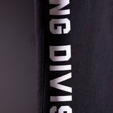 FA'23 Straight Leg Jogger in black with white branding, detail shot of side seam text