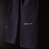 FA'23 Straight Leg Jogger in black, close-up detail of pant legs with Korean text