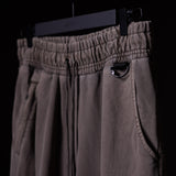 WN'20 Terry Relaxed Jogger in taupe, hanging on display with detail of pocket and drawstring
