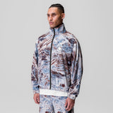 Aerotex™ Track Jacket in blue and brown Realtree® Aspect camo, worn by model, side view