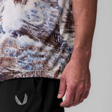 Ice-Skin Oversized Tee in brown/blue Realtree camo, worn by model showing side view