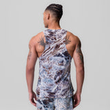 Laser-Vent™ Singlet Tank in blue marble print, worn by model showing back view