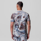 Tetra-Lite Ice Zip Tee in blue/brown marble print, back view on model