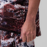 Towel Terry Cutoff in red camo print, modeled on person showing side detail