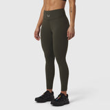 W002 LYCRA® ADAPTIV legging in olive, modeled from waist down with black sneakers