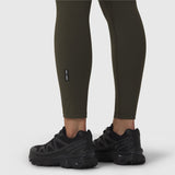 W002 LYCRA® ADAPTIV legging in olive worn with black sneakers, lower body view