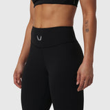 Black LYCRA® ADAPTIV legging on model, waist-down side view