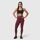 W002 LYCRA® ADAPTIV Legging in crimson, worn with black sports bra and black sneakers