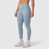 W002 LYCRA® ADAPTIV legging in light sky, worn with white sneakers, side view