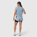 Laser-Vent Established Tee in light sky, worn by model from behind while running