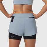 W025 Tetra-Lite Liner Short in light sky, back view on model